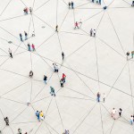 Arial view of multiple people to show collaboration concept graphically as they are all connected through lines.